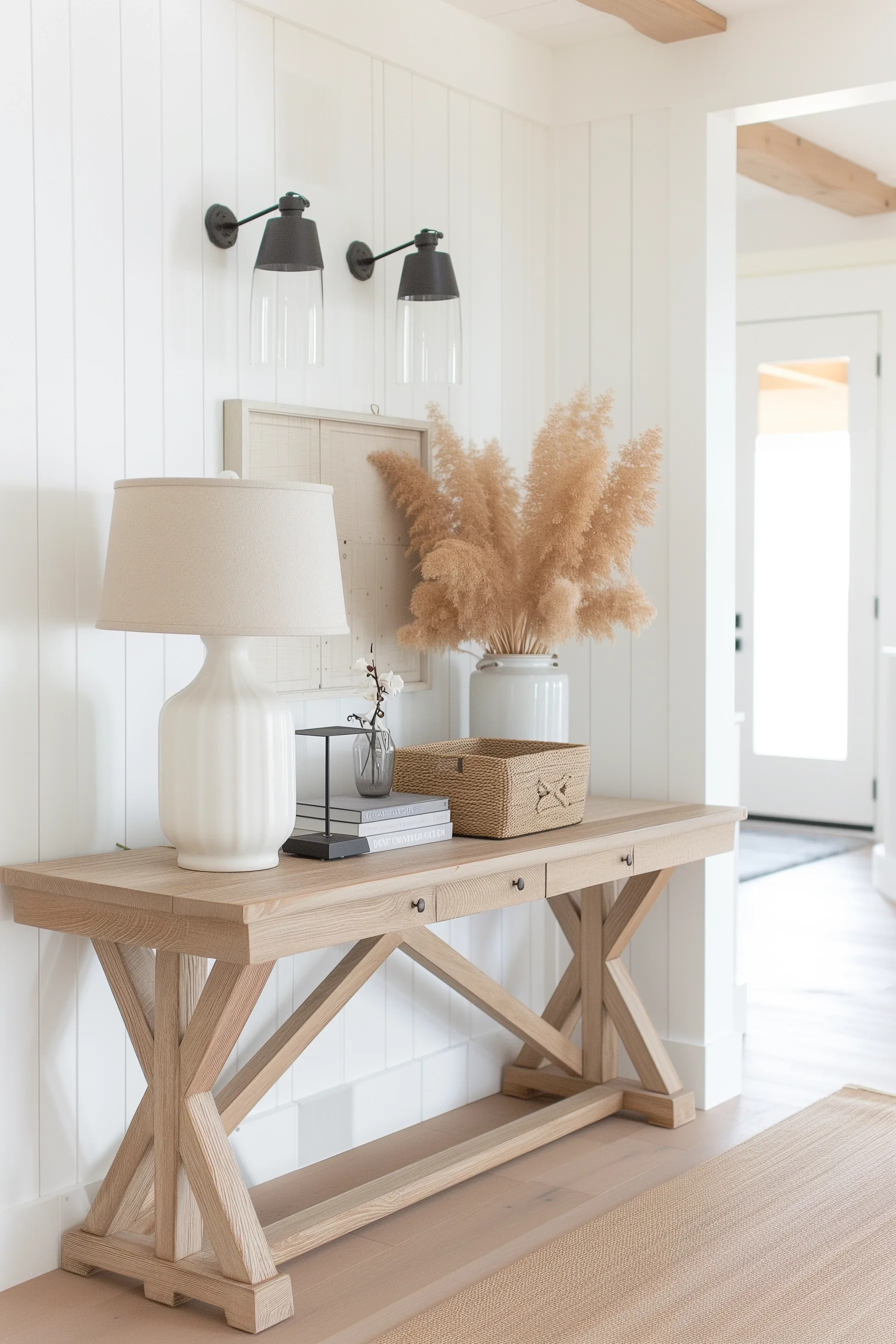 A farmhouse entry table with pampas grass