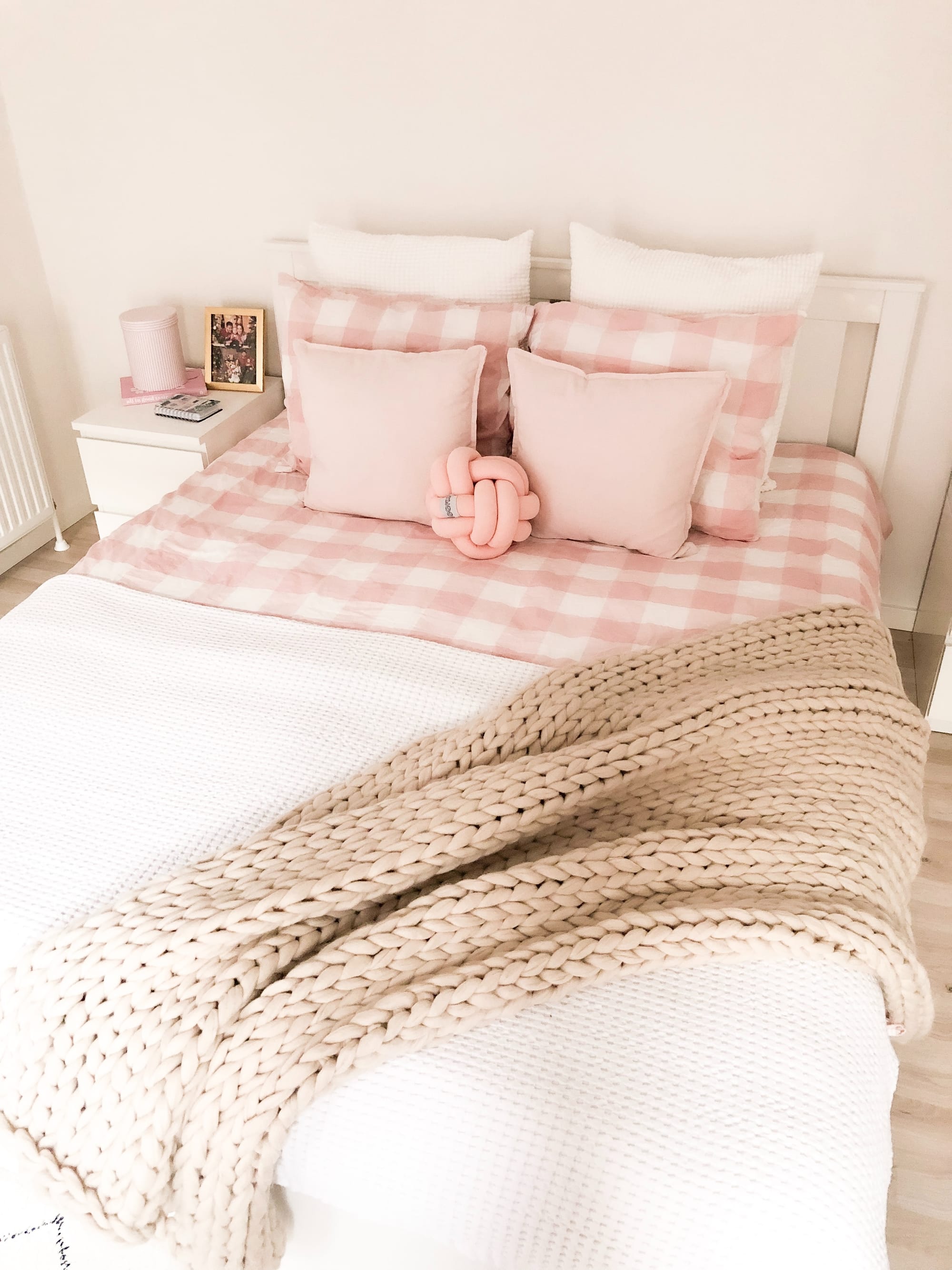 A pink and white bedroom