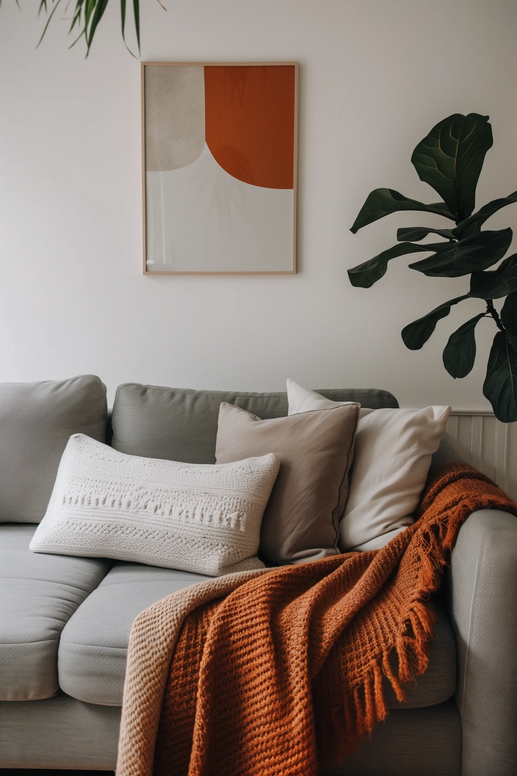 grey couch with throw pillows